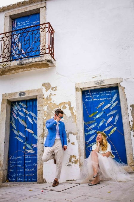 Groom looking over the top of his sunglasses at bride - Picture by Memories by Magda