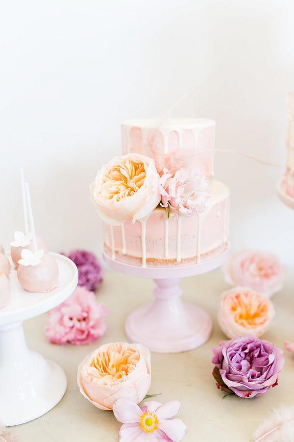 Drip wedding cake with peach flowers