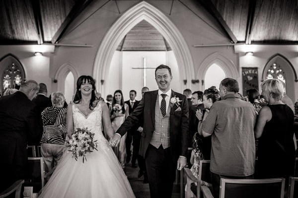 Bride and groom leaving church