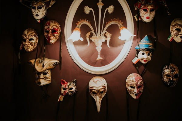 Venetian masks on wall at Penventon Park Hotel