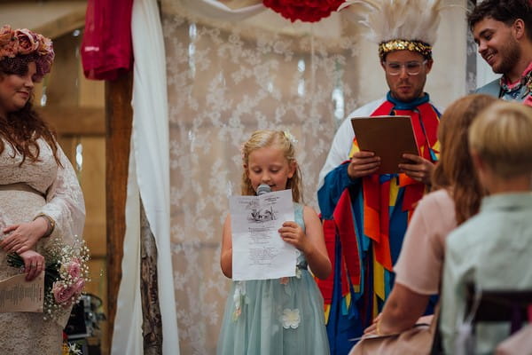 Flower girl doing wedding reading