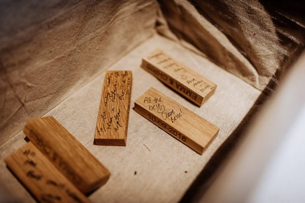 Jenga pieces with wedding guests' messages written on