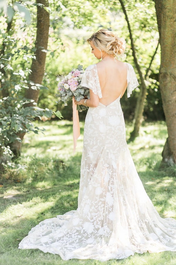 Bride's wearing open-back wedding dress