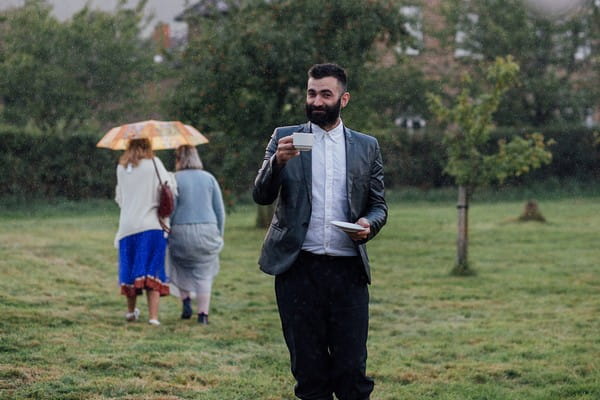 Wedding guest with cup of tea