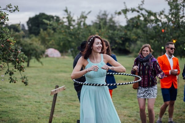 Bridesmaid laying with hula hoop