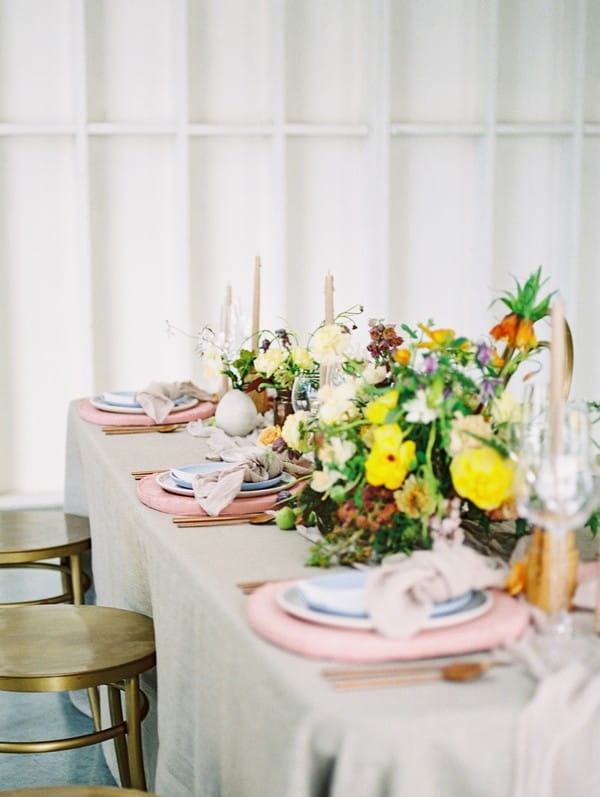 Floral wedding table centrepiece with yellow flowers