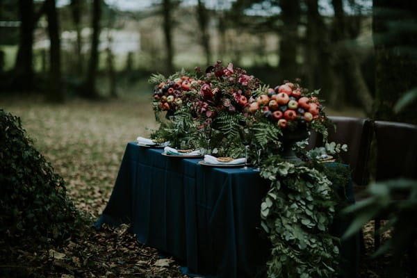 Wedding table with dark blue tablecloth