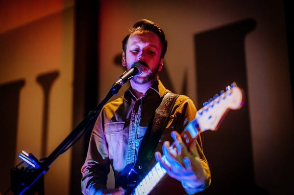 Wedding band guitarist singing