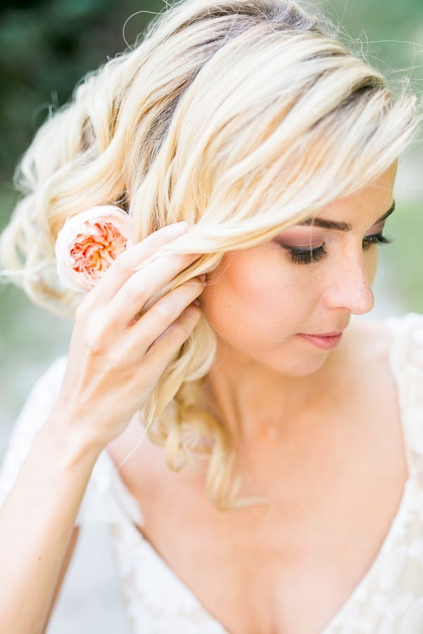 Bride with updo hairstyle with flower in hair