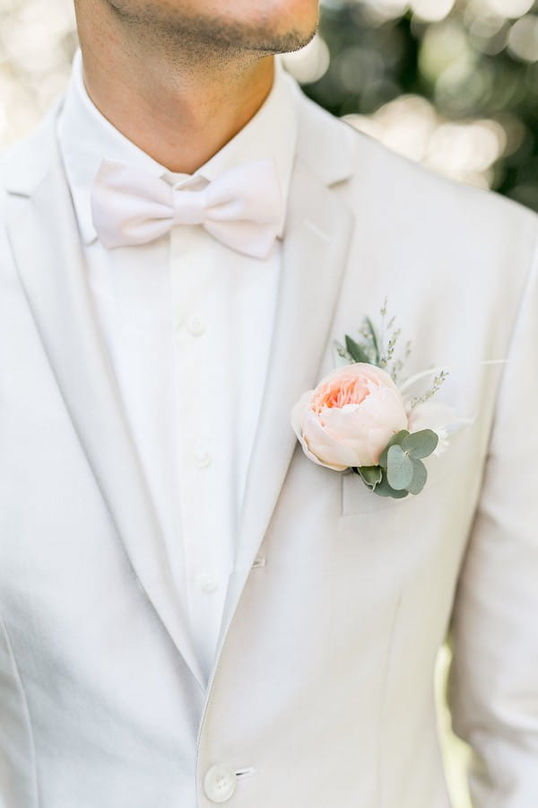 Groom's peach flower buttonhole