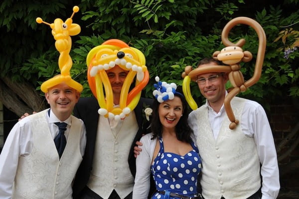 Wedding Guests with Balloon Models on their Heads