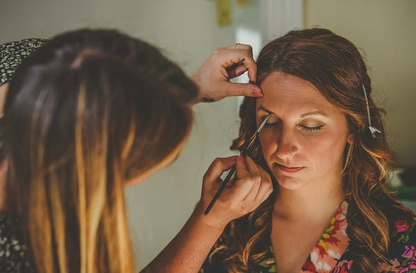 Bride having make-up done