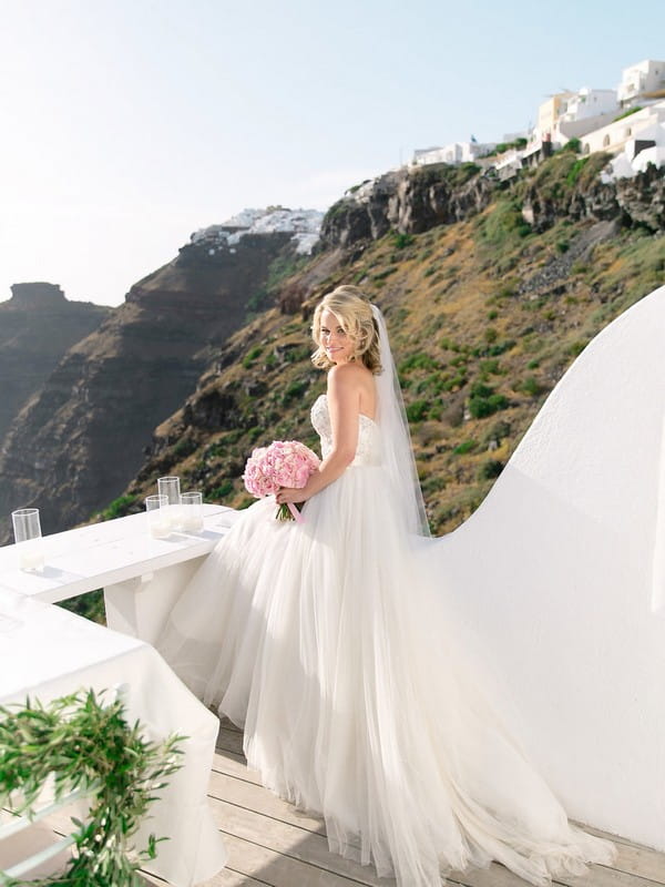 Bride on balcony in Santorini