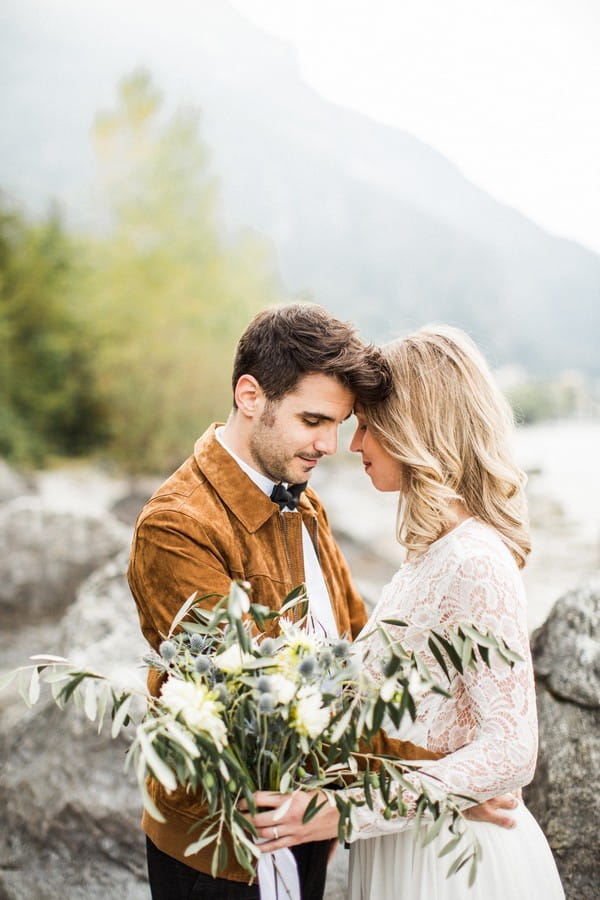 Bride and groom touching heads