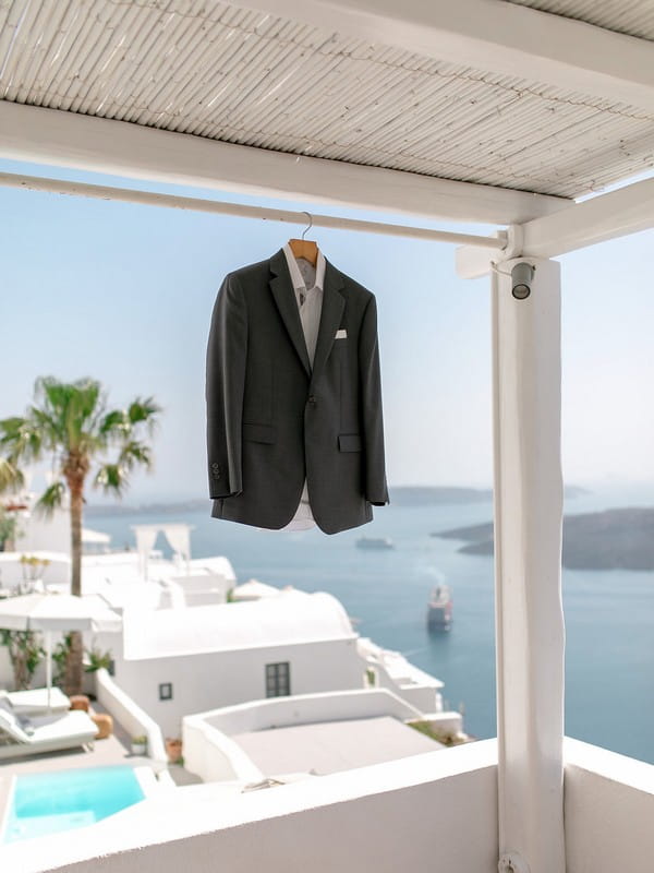 Groom's suit jacket hanging from canopy