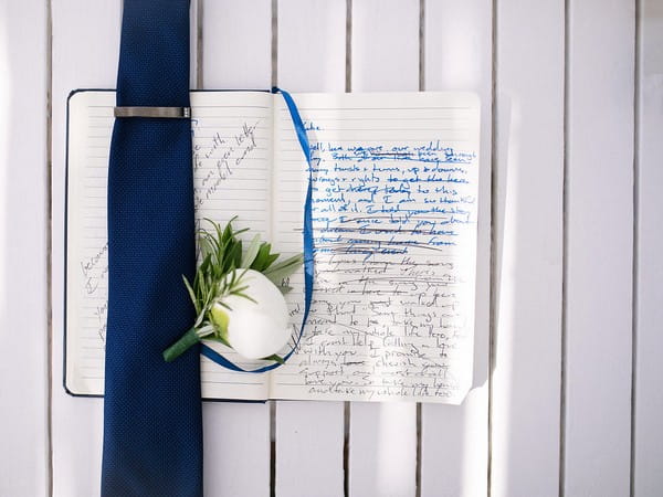 Groom's tie on top of vows