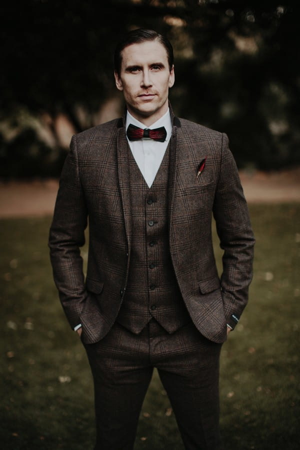 Groom in tweed with hands in pockets