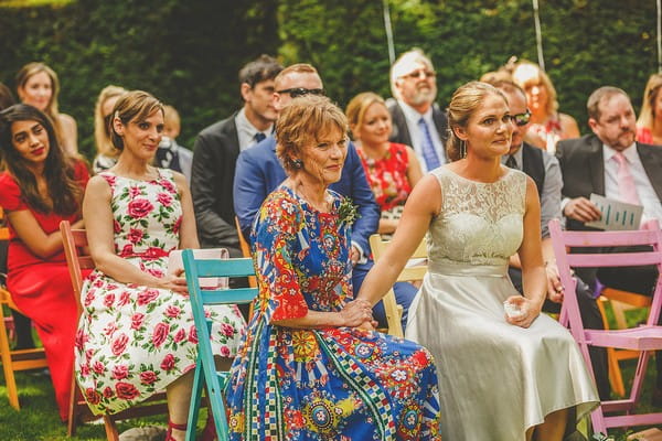 Mother watching as daughter gets married