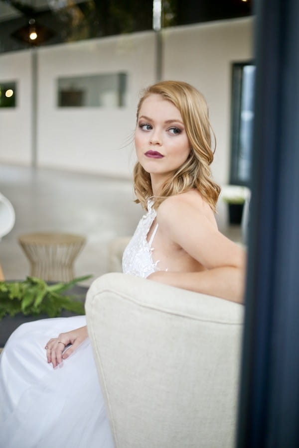 Bride sitting looking over her shoulder