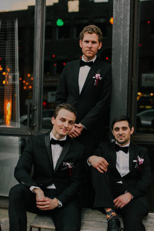 Groomsmen wearing suits and bow ties