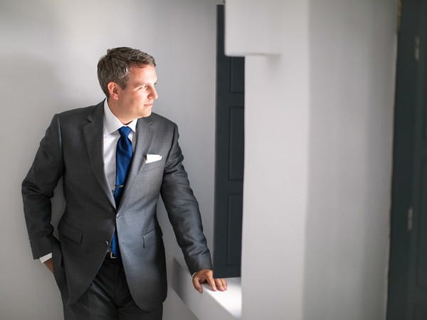 Groom looking out of window