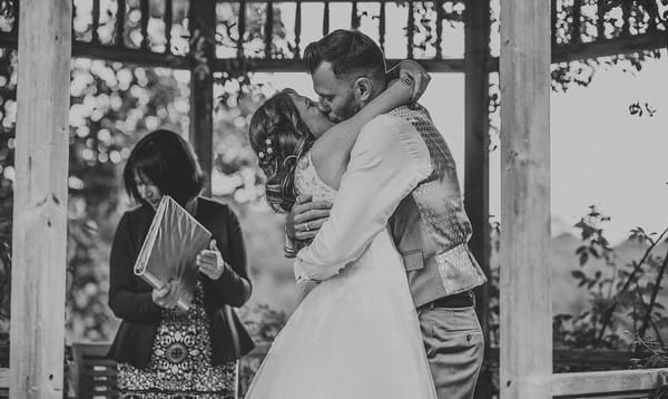 Bride and groom kiss