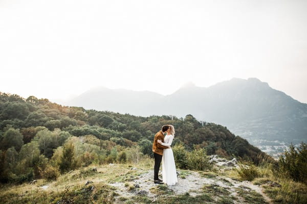 Bride and groom at top of mountain at Lake Como