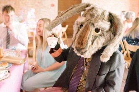 Wedding guest wearing rabbit costume head holding tea cup - Picture by Gabrielle Bower Photography