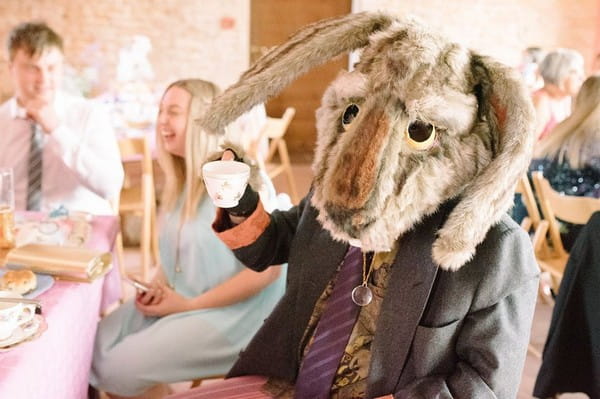 Wedding guest wearing rabbit costume head holding tea cup - Picture by Gabrielle Bower Photography