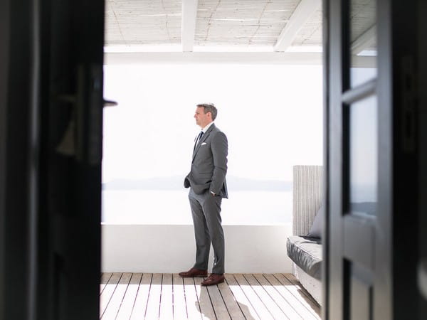 Groom with hands in pocket