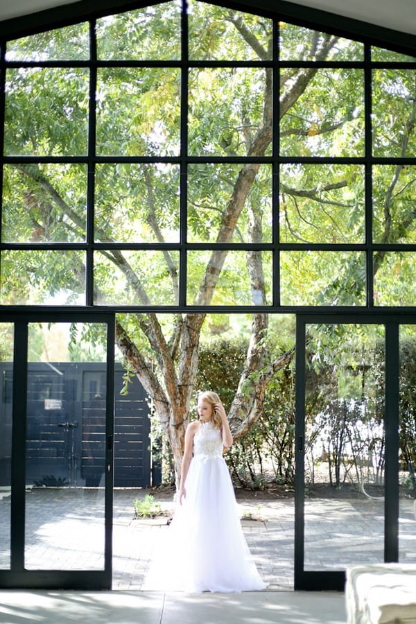 Bride standing at door of The Conservatory Franschhoek