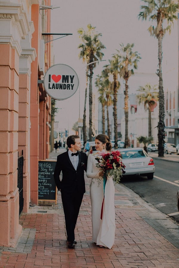 Bride and groom walking in Cape Town