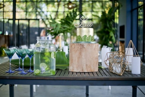 Wedding cake on table with glasses and drinks