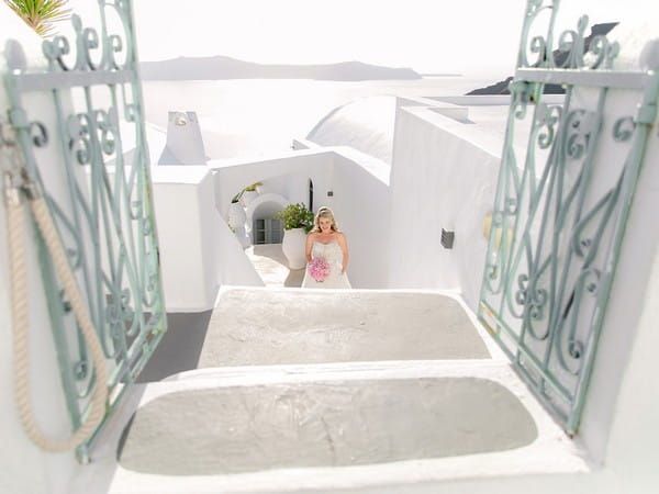 Bride walking up stairs to wedding ceremony