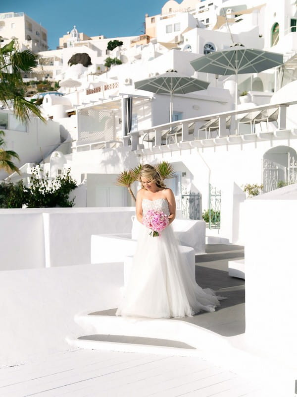 Bride arriving at wedding ceremony in Santorini