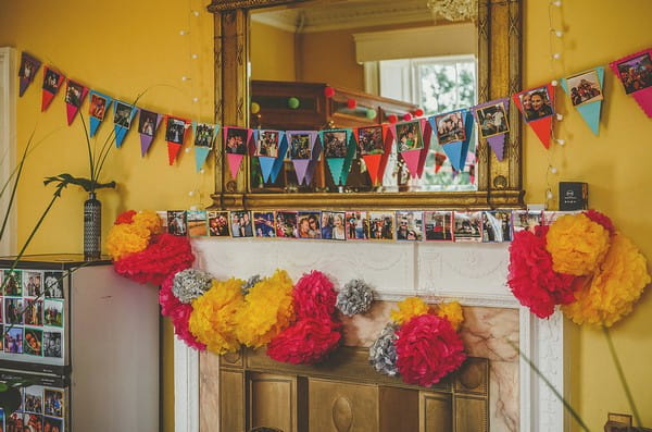 Bunting and pom poms around fireplace at Colehayes Park