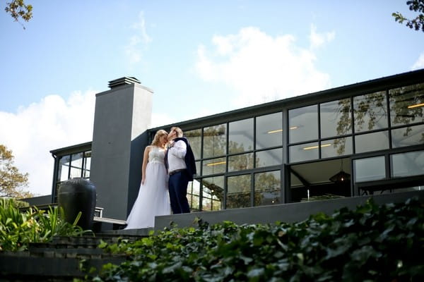 Bride and groom outside The Conservatory Franschhoek