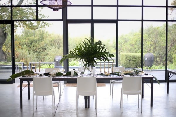 Palm leaf centrepiece on wedding table