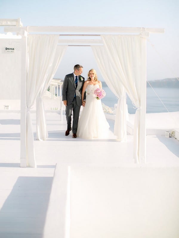 Bride and groom leaving wedding ceremony