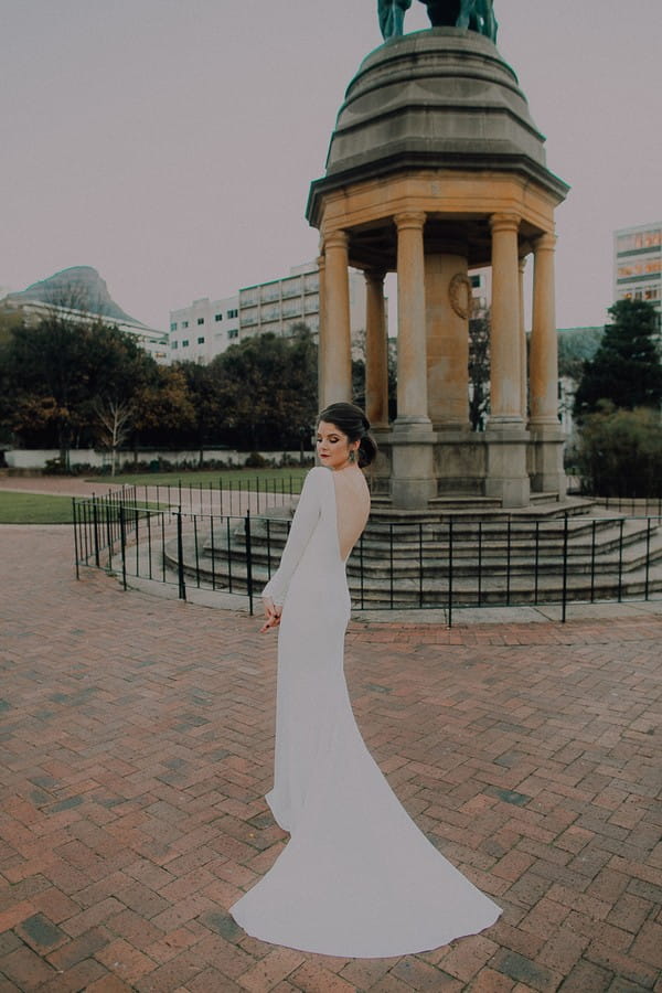 Bride standing by monument