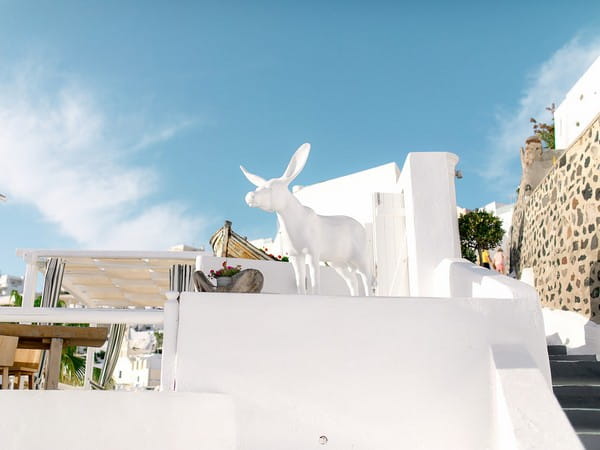 Animal figure on wall in Santorini