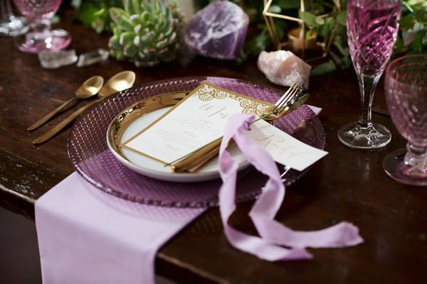 Wedding place setting with purple and lavender styling