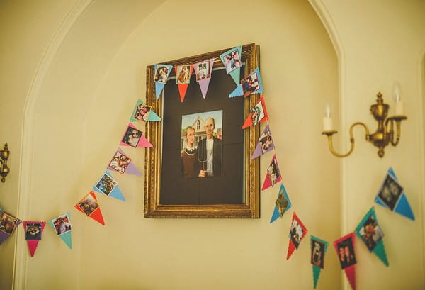 Picture on wall with bunting hanging from it