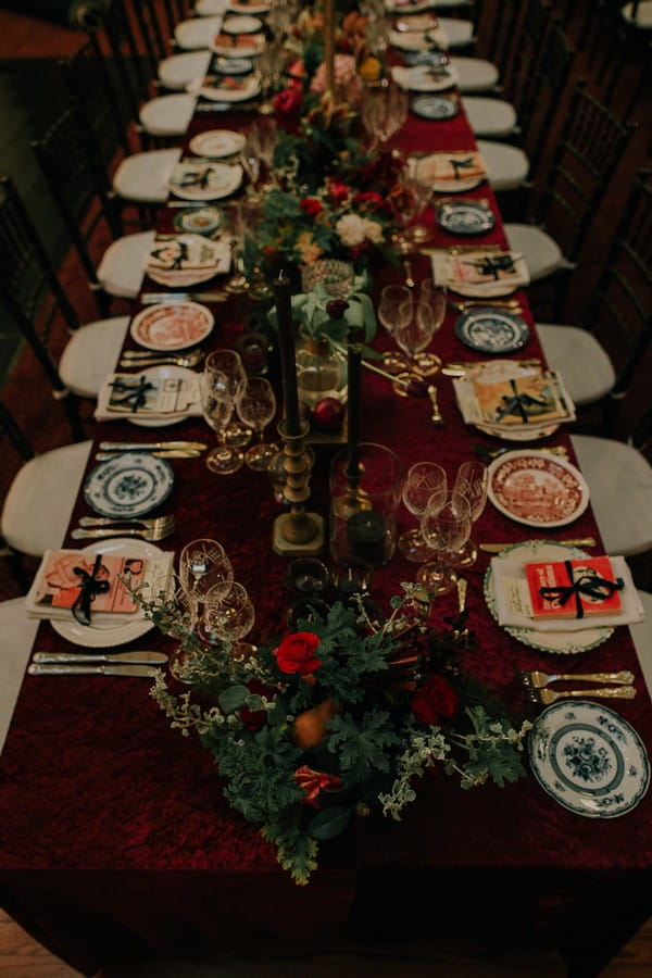 Long wedding table with books at each place