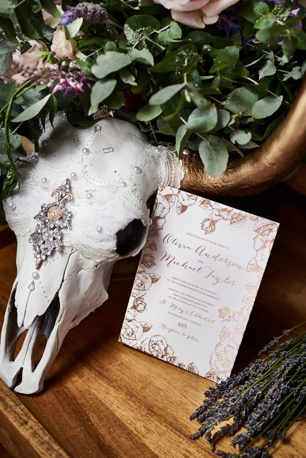 Cow skull with wedding invitation