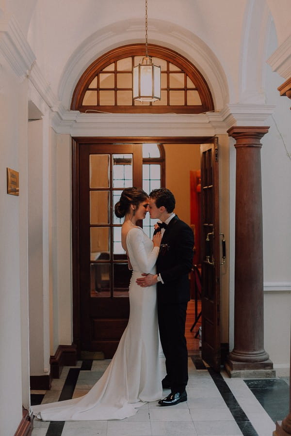 Bride and groom in hall of Centre for the Book