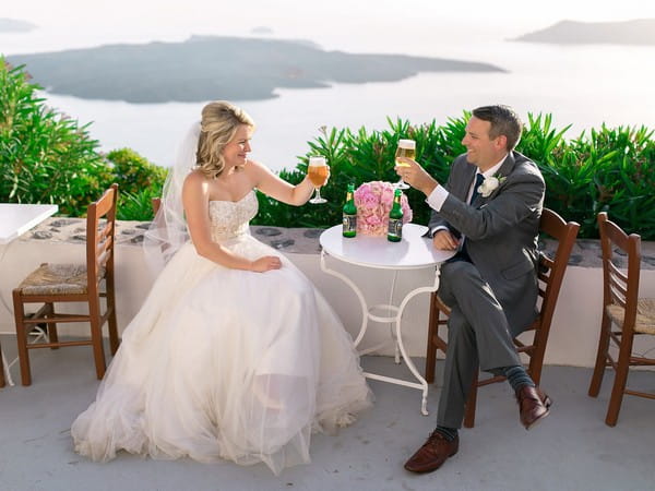 Bride and groom drinking beer