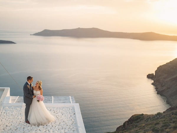 Bride and groom in front of sea