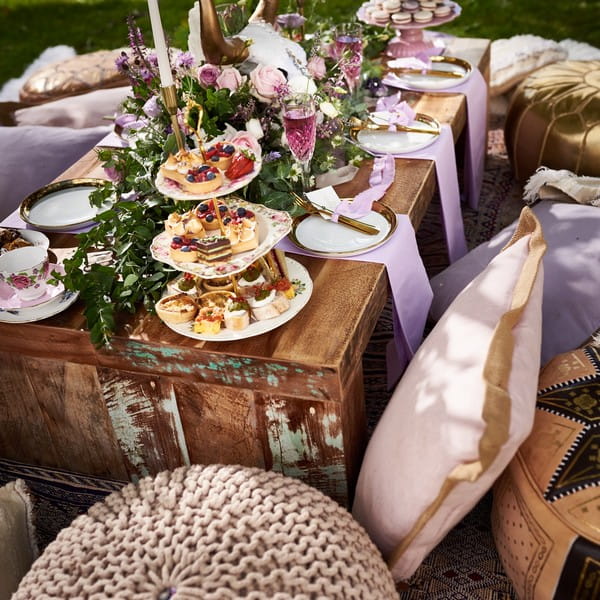 Outdoor wedding table display with cushion seating