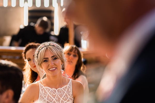 Bride listening to father's wedding speech